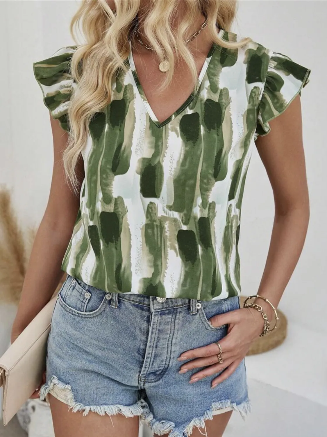Ruffled Printed V-Neck Cap Sleeve Blouse