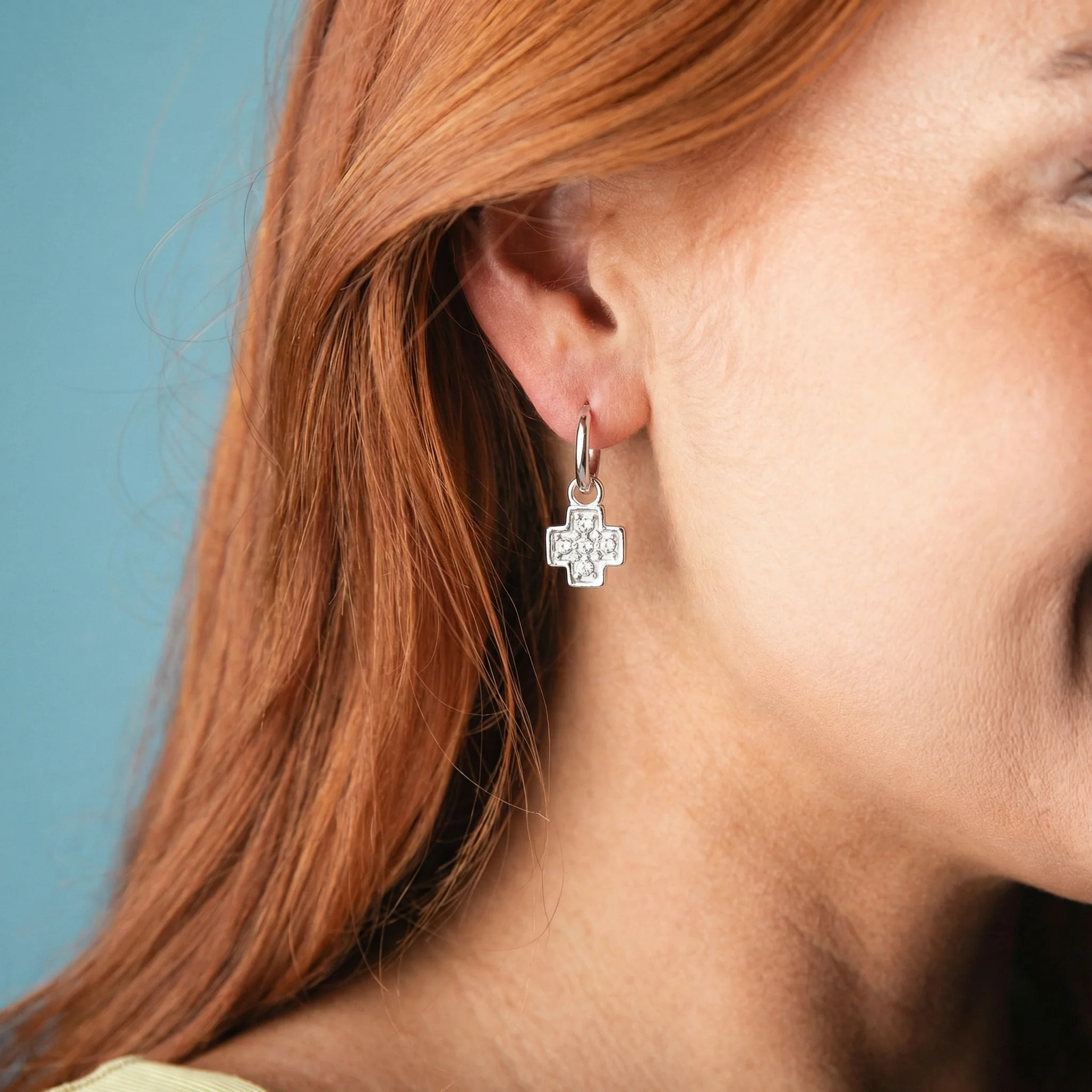 Silver Huggie Earring with Clear Crystal Cross - Image 2